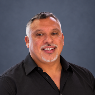 Warm Professional Portrait on Slate Background